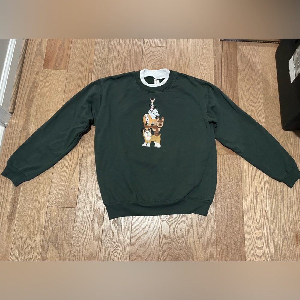 Ladies sweatshirt with dog’s emblem.